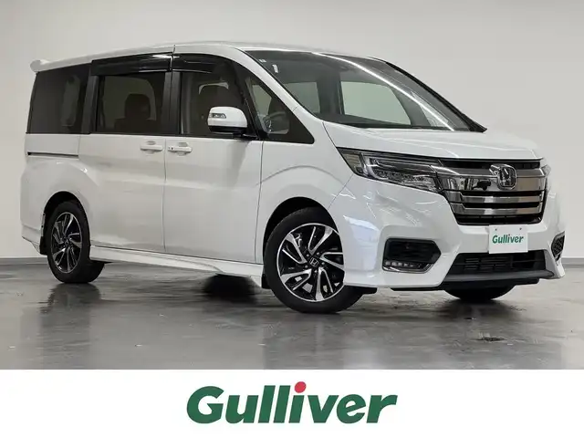 ホンダ ステップワゴン スパーダ クルスピセンシング 三重県 2020(令2)年 5.5万km プラチナホワイトパール ガソリン・ターボ/FF/MTモード付インパネCVT/純正 9インチナビ VXM-207VFNi/（CD/DVD/RADIO/TV/SD/MusicRack/USB/iPod/Bluetooth/HDMI/AppleCarPlay）/純正 11.6インチ 後席モニター VM-185EN/バックカメラ/両側パワースライドドア/ドライブレコーダー 前後/ビルトイン ETC2.0/Honda SENSING/・衝突軽減ブレーキ［CMBS］/・車線維持支援システム［LKAS］/・アダプティブクルーズコントロール［ACC］/・路外逸脱抑制機能/・先行車発進お知らせ機能/・標識認識機能/装備/・ハーフレザーシート/・シートヒーター（D/N）/・トリプルゾーン・フルオートエアコン（D/N/2nd）/・オートライト/・LED ヘッドライト＆フロントフォグランプ/・ステアリングスイッチ/・純正17inAW/・プッシュスタート/・保/取/・スマートキーx2