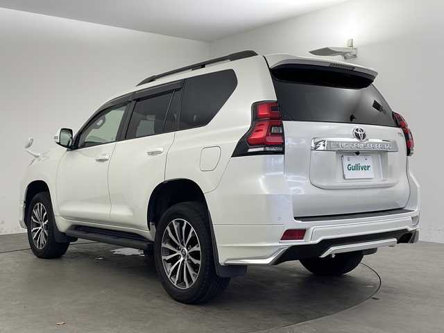 トヨタ ランドクルーザー プラド TX Lパッケージ 兵庫県 2020(令2)年 2.3万km ホワイトパールクリスタルシャイン ・モデリスタエアロ/・プリクラッシュセーフティ/・レーンディパーチャーアラート/・オートマチックハイビーム/・レーダークルーズコントロール（ブレーキ制御付）/・クリアランスソナー &バックソナー/・LEDヘッドランプ［ハイ・ロービーム］/・オートレベリング機能付/・LEDクリアランスランプ（デイライト機能付）/・ヘッドランプクリーナー/・ルーフレール/・純正9型ナビ＆TV＆BT＆DVD＆HDMI＆CD/・バックカメラ/・前後ドライブレコーダー/・ビルトインETC2.0/・スマートキー/・スペアキー/・プッシュスタート/・ステアリングリモコン/・黒革シート/・前席パワーシート/・前席シートヒーター/・前席シートクーラー/・フォグランプ/・オートライト/・純正フロアマット/・純正19インチアルミホイール/・横滑り防止装置