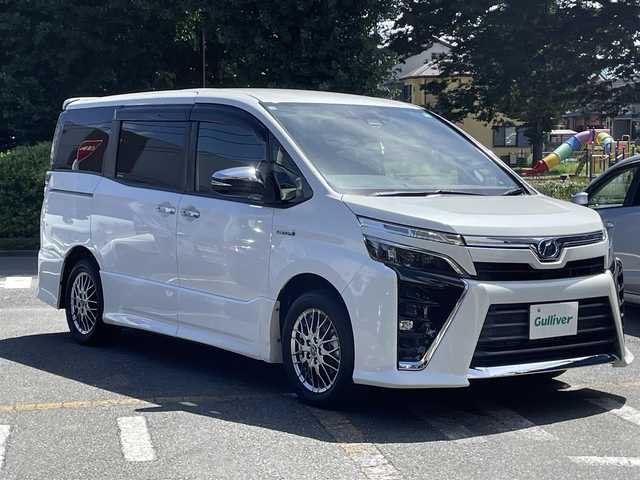 トヨタ ヴォクシー ハイブリッド ZS 煌 神奈川県 2018(平30)年 3万km ホワイトパールクリスタルシャイン ワンオーナー/セイフティセンス/クルーズコントロール/両側パワースライドドア/ディーラーOPナビ/CD/DVD/Bluetooth/地デジ/バックカメラ/ETC/LEDヘッドライト/フリップダウンモニター/スマートキー/保証書/取説/スペアキーあり