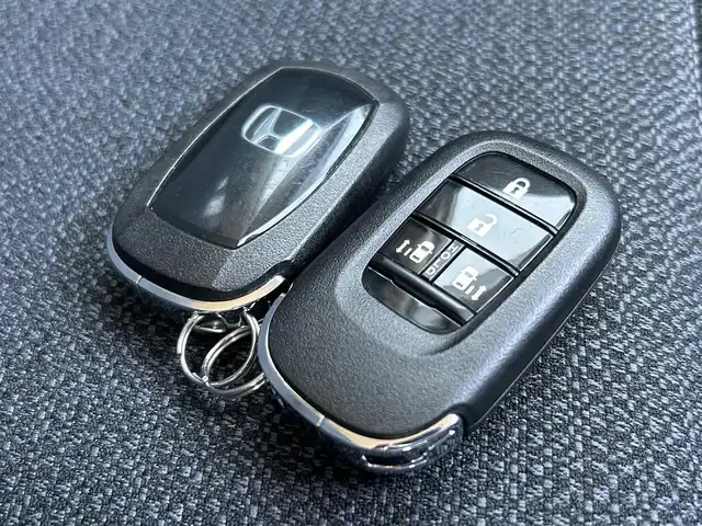 ホンダ ステップワゴン エアー 愛媛県 2022(令4)年 1.5万km フィヨルドミストパール ETC/社外ナビ/3列シート/バックカメラ/LEDヘッドライト/両側パワースライドドア/クルーズコントロール/エンジンスタートボタン/コーナーセンサー