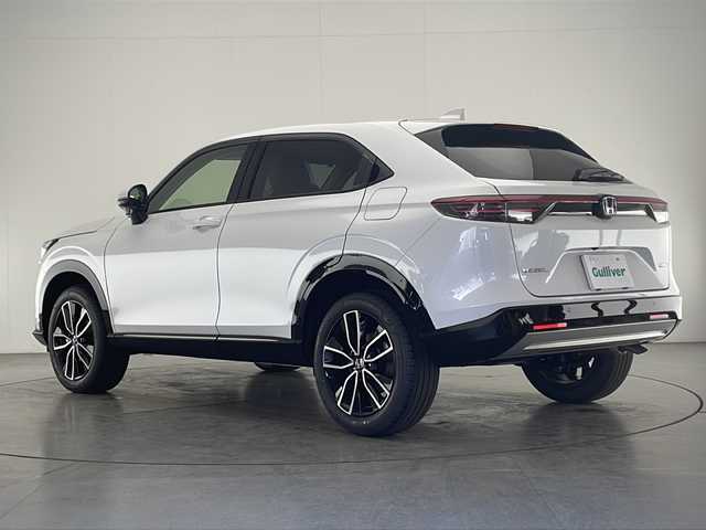 ホンダ ヴェゼル ハイブリッド e:HEV Z 宮崎県 2025(令7)年 0.1千km プラチナホワイトパール 登録済み未使用車/ホンダセンシング/純正9型ディスプレイオーディオナビTV/（Honda CONNECT/Bluetooth/FMAM/HDMI/フルセグTV)/純正ビルトイン2.0ETC/純正ワイヤレス充電器/純正LEDオートライト/純正LEDフォグ/純正18インチアルミ/アダプティブクルーズコントロール/レーンディパーチャーアラート/ダウンヒルアシストコントロール/ブラインドスポットモニター/クリアランスソナー/パワーバックドア/電子パーキング/オートホールド/パドルシフト/本革巻ハンドル/ハーフレザーシート/前席シートヒーター/ステアリングヒーター/デュアルオートエアコン/スマートキー/プッシュエンジンスタート/スペアキー/新車時保証書/取扱い説明書