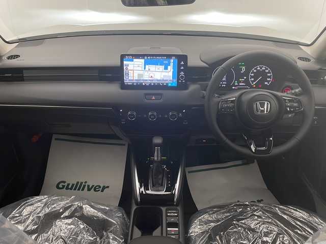 ホンダ ヴェゼル ハイブリッド e:HEV Z 宮崎県 2025(令7)年 0.1千km プラチナホワイトパール 登録済み未使用車/ホンダセンシング/純正9型ディスプレイオーディオナビTV/（Honda CONNECT/Bluetooth/FMAM/HDMI/フルセグTV)/純正ビルトイン2.0ETC/純正ワイヤレス充電器/純正LEDオートライト/純正LEDフォグ/純正18インチアルミ/アダプティブクルーズコントロール/レーンディパーチャーアラート/ダウンヒルアシストコントロール/ブラインドスポットモニター/クリアランスソナー/パワーバックドア/電子パーキング/オートホールド/パドルシフト/本革巻ハンドル/ハーフレザーシート/前席シートヒーター/ステアリングヒーター/デュアルオートエアコン/スマートキー/プッシュエンジンスタート/スペアキー/新車時保証書/取扱い説明書