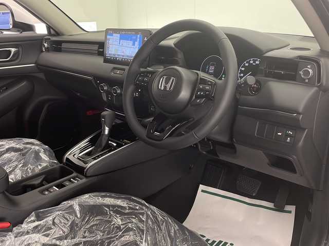 ホンダ ヴェゼル ハイブリッド e:HEV Z 宮崎県 2025(令7)年 0.1千km プラチナホワイトパール 登録済み未使用車/ホンダセンシング/純正9型ディスプレイオーディオナビTV/（Honda CONNECT/Bluetooth/FMAM/HDMI/フルセグTV)/純正ビルトイン2.0ETC/純正ワイヤレス充電器/純正LEDオートライト/純正LEDフォグ/純正18インチアルミ/アダプティブクルーズコントロール/レーンディパーチャーアラート/ダウンヒルアシストコントロール/ブラインドスポットモニター/クリアランスソナー/パワーバックドア/電子パーキング/オートホールド/パドルシフト/本革巻ハンドル/ハーフレザーシート/前席シートヒーター/ステアリングヒーター/デュアルオートエアコン/スマートキー/プッシュエンジンスタート/スペアキー/新車時保証書/取扱い説明書