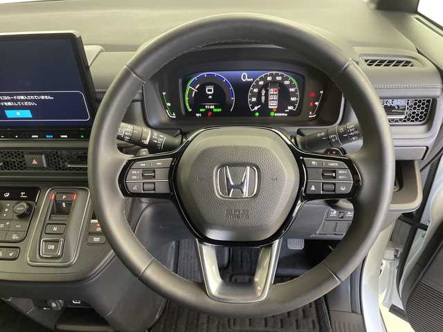 ホンダ ステップワゴン 鹿児島県 2024(令6)年 1.3万km プラチナホワイトパール 純正１１．４型ナビ/（フルセグ/Bluetooth/DVD/CD）/純正フリップダウンモニター　/両側パワースライドドア　/バックカメラ　/パワーバックドア　/ＨＤＭＩ入力端子　/前後ドライブレコーダー　/シートヒーター　/オットマン　/アダプティブクルーズコントロール/ハーフレザー/ブラインドスポットモニター/ETC/オートライト/プッシュスタートボタン/保証書/取扱説明書/スペアキー1本