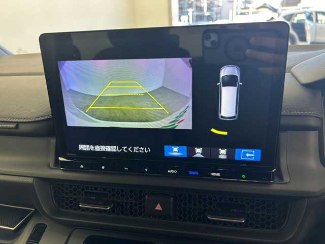 ホンダ ステップワゴン 鹿児島県 2024(令6)年 1.3万km プラチナホワイトパール 純正１１．４型ナビ/（フルセグ/Bluetooth/DVD/CD）/純正フリップダウンモニター　/両側パワースライドドア　/バックカメラ　/パワーバックドア　/ＨＤＭＩ入力端子　/前後ドライブレコーダー　/シートヒーター　/オットマン　/アダプティブクルーズコントロール/ハーフレザー/ブラインドスポットモニター/ETC/オートライト/プッシュスタートボタン/保証書/取扱説明書/スペアキー1本