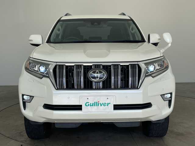 トヨタ ランドクルーザー プラド TX 兵庫県 2018(平30)年 6.4万km ホワイトパールクリスタルシャイン ・社外ナビ/CD/DVD/SD/TV/Bluetooth/・バックカメラ/・ビルトインETC/・ドライブレコーダー/・Toyota　Safety　Sense/・プリクラッシュセーフティ/・レーンディパーチャーアラート/・オートマチックハイビーム/・レーダークルーズコントロール/・VSC/・アクティブトラクションコントロール/・ダウンヒルアシストコントロール/・ヒルスタートアシストコントロール/・ハイドロブレーキブースター/・電動センターデフロック/・ＬＥＤヘッドライト/・フォグランプ/・オートライト/・RAYS製gram LIGHTSアルミホイール/・JAOS BATTLEZ リフトアップ/・スマートキー
