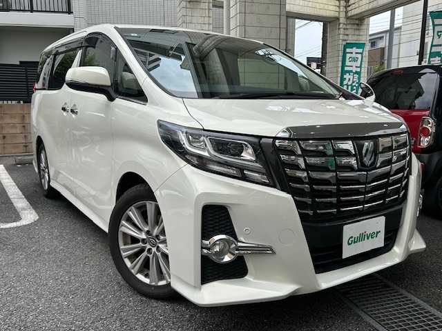 トヨタ アルファード S 東京都 2015(平27)年 7.7万km ラグジュアリーホワイトパールクリスタルシャインガラスフレーク 登録時走行76900km/ワンオーナー/レーダークルーズコントロール/プリクラッシュセーフティシステム/インテリジェントクリアランスソナー/純正メモリーナビ・フルセグTV/バックカメラ/両側パワースライドドア/LEDライト/ビルトインETC/革調シートカバー/アクセサリーコンセント/純正18インチAW/H28.R6年記録簿/保証書・取説/スペアキー