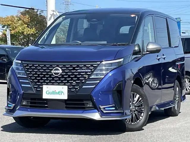 日産 セレナ オーテック 道央・札幌 2023(令5)年 1.2万km 青 ４WD/ワンオーナー/純正メーカーナビ/AM/FM/BT/フルセグ/純正フリップダウンモニター/エマージェンシーブレーキ/横滑り防止装置/レーダークルーズコントロール/レーンキープアシスト/ハンドル支援/クリアランスソナー/アラウンドビューモニター/ビルトインETC/アイドリングストップ/デジタルインナーミラー/両側パワースライドドア/前席/2列目シートヒーター/レザーシート/革巻きステアリング/ステアリングリモコン/パドルシフト/ハンドルヒーター/置くだけ充電/電動パーキング/オートブレーキホールド/プッシュスタート/スマートキー/LEDヘッドライト/オートライト/オートハイビーム/フォグランプ/電動格納ミラー/ウィンカーミラー/純正フロアマット/スペアキー