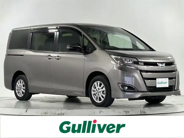 トヨタ ノア ハイブリッド G 佐賀県 2019(令1)年 3.6万km アバンギャルドブロンズメタリック 純正９インチSDナビ/CD DVD TV/衝突軽減システム/両側パワースライドドア/シートヒーター/トヨタセーフティー/レーンキープアシスト/クリアランスソナー/ビルトインETC/ドラレコ前後/LEDヘッドライト/オートライト/オートマチックハイビーム