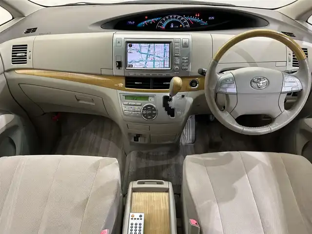 トヨタ エスティマ アエラス Gパッケージ 愛媛県 2006(平18)年 6.7万km パール 純正ＨＤＤナビバック・サイド・フロントカメラ　ＥＴＣ　純正フロアマット　純アルミホイール　ハロゲンヘッドライト　三列シート　フラットシート　パワーシート　スマートキーＷＡＣクルーズコントロル
