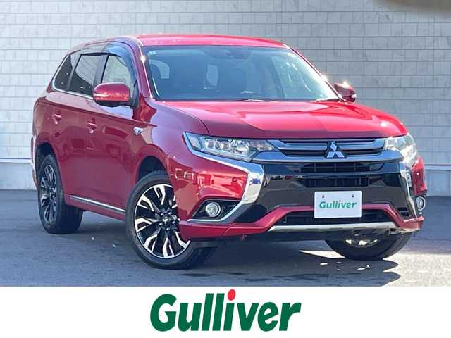 三菱 アウトランダー ＰＨＥＶ G セーフティパッケージ 群馬県 2016(平28)年 8万km レッドメタリック 純正ＳＤナビ　/バックカメラ　/フルセグ　/充電ケーブル　/黒ハーフレザーシート　/１００Ｖ充電　/前席シートヒーター　/Ｄ席パワーシート　/ステアリングヒーター　/アダプティブクルーズコントロール　/純正フロアマット/パワーステアリング/LEDヘッドライト