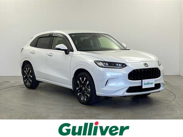 ホンダ ＺＲ－Ｖ ハイブリッド e:HEV Z 栃木県 2023(令5)年 2.5万km プラチナホワイトパール ワンオーナー/本革シート/BOSEプレミアムサウンドシステム/純正7インチワイドナビ/・フルセグTV/AM/FM/・Apple CarPlay/Android Auto/Bluetooth/USB/HDMI/ホンダセンシング/・衝突軽減ブレーキ/・誤発進抑制/・路外逸脱抑制/・パーキングセンサー/・渋滞追従機能付アダプティブクルーズコントロール/・車線維持支援/・アダプティブドライビングビーム/・ブラインドスポットモニタリング/・歩行者事故低減ステアリング/・先行者発進お知らせ/・標識認識/マルチビューカメラ/ビルトインETC2.0/ワイヤレス充電/電動リアゲート/純正前後ドライブレコーダー/ハーフレザーシート(合皮)/シートヒーター(D/N席)/パワーシート(D/N席)/ヒルディセントコントロール/LEDヘッドライト/フォグランプ/純正18インチアルミホイール/ドアバイザー/純正フロアマット/サイド+カーテンエアバッグ/スマートキー×2本/保証書、取扱説明書