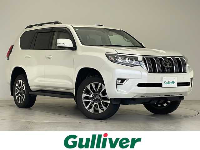 トヨタ ランドクルーザー プラド TX Lパッケージ 愛知県 2023(令5)年 2.4万km ホワイトパールクリスタルシャイン 衝突軽減システム/純正9型ディズプレイオーディオ　ナビあり/全方位カメラ/サンルーフ/レーダークルーズコントロール/シートヒーター/エアシート/フルセグ/バックカメラ/パワーシート/コーナーセンサー/ルーフレール/ETC2.0/LEDヘッドライト/オートマチックハイビーム/ドライブレコーダー/ステアリングスイッチ/スマートキー/プッシュスタート