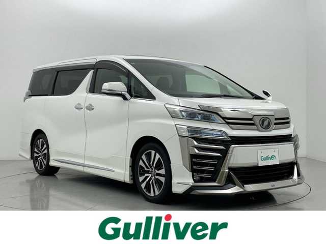 トヨタ ヴェルファイア Z Gエディション 熊本県 2018(平30)年 5.6万km ホワイトパールクリスタルシャイン モデリスタエアロフル（Ｆ・Ｓ・Ｒ）/モデリスタマフラー　/純正１０インチナビNSZN-Z66T（CD・DVD・フルセグ・BT・SD・USB）/純正１２型フリップダウンモニター　/サンルーフ　/バックカメラ/レーダークルーズコントロール/パワーバックドア　/セーフティセンス/衝突軽減ブレーキ/レーンキープアシスト/横滑り防止/前席シートヒーター/前席エアーシート/前席・2列目パワーシート　/シートメモリー/ステアリングヒーター/オットマン/両側パワースライドドア/純正フロアマット/純正１８インチAW/オートライト/オートマチックハイビーム/LEDヘッドライト/フォグランプ/スマートキー/プッシュスタート/スペアキー1本/取扱説明書