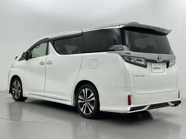 トヨタ ヴェルファイア Z Gエディション 熊本県 2018(平30)年 5.6万km ホワイトパールクリスタルシャイン モデリスタエアロフル（Ｆ・Ｓ・Ｒ）/モデリスタマフラー　/純正１０インチナビNSZN-Z66T（CD・DVD・フルセグ・BT・SD・USB）/純正１２型フリップダウンモニター　/サンルーフ　/バックカメラ/レーダークルーズコントロール/パワーバックドア　/セーフティセンス/衝突軽減ブレーキ/レーンキープアシスト/横滑り防止/前席シートヒーター/前席エアーシート/前席・2列目パワーシート　/シートメモリー/ステアリングヒーター/オットマン/両側パワースライドドア/純正フロアマット/純正１８インチAW/オートライト/オートマチックハイビーム/LEDヘッドライト/フォグランプ/スマートキー/プッシュスタート/スペアキー1本/取扱説明書