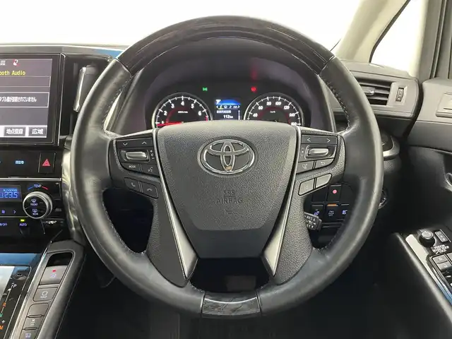 トヨタ ヴェルファイア Z Gエディション 熊本県 2018(平30)年 5.6万km ホワイトパールクリスタルシャイン モデリスタエアロフル（Ｆ・Ｓ・Ｒ）/モデリスタマフラー　/純正１０インチナビNSZN-Z66T（CD・DVD・フルセグ・BT・SD・USB）/純正１２型フリップダウンモニター　/サンルーフ　/バックカメラ/レーダークルーズコントロール/パワーバックドア　/セーフティセンス/衝突軽減ブレーキ/レーンキープアシスト/横滑り防止/前席シートヒーター/前席エアーシート/前席・2列目パワーシート　/シートメモリー/ステアリングヒーター/オットマン/両側パワースライドドア/純正フロアマット/純正１８インチAW/オートライト/オートマチックハイビーム/LEDヘッドライト/フォグランプ/スマートキー/プッシュスタート/スペアキー1本/取扱説明書