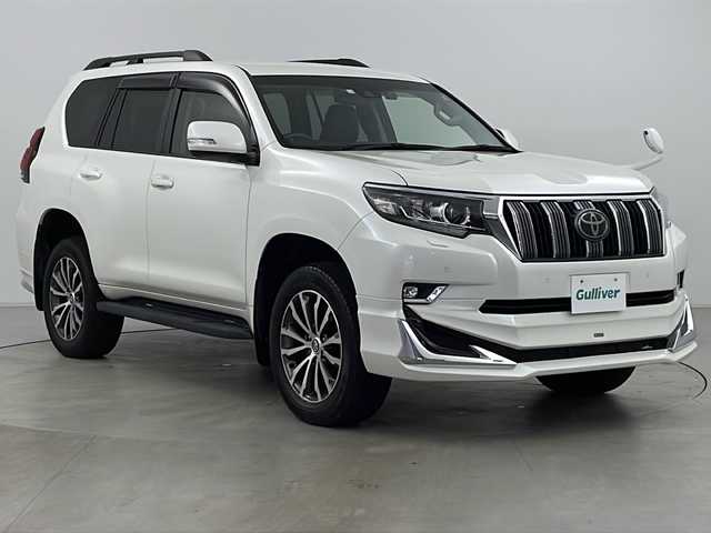 トヨタ ランドクルーザー プラド TX Lパッケージ 道央・札幌 2018(平30)年 1.9万km ホワイトパールクリスタルシャイン ・4WD/・ワンオーナー/・純正ナビ&CD&DVD&BT&TV/・バックカメラ/・レーダークルーズコントロール/・衝突被害軽減ブレーキ/・レーンキープアシスト/・コーナーセンサー/・前席シートヒーター/・前席ベンチレーションシート/・レザーシート/・ETC/・ドライブレコーダー/・モデリスタエアロ/・LEDヘッドライト/・オートライト/・オートマチックハイビーム/・スマートキー