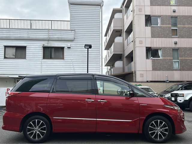 トヨタ エスティマ ハイブリッド アエラス プレミアム G 高知県 2019(令1)年 3.2万km ブラック/レッドマイカメタリック 2トーン 両側パワースライドドア　/純正12型フリップダウンモニター　（V12T-R18C)　/純正１０インチナビ　（NSZN-Z68T）/【Ｂｌｕｅｔｏｏｔｈ　ＴＶ　ＤＶＤ　ＣＤ　Ｔ－ｃｏｎｎｅｃｔ　後席会話支援】/バックカメラ　/ＥＴＣ２．０　/前後ドラレコ　/運転席パワーシート/1列目シートヒーター/2列目オットマン/電動格納サードシート/電動リアゲート/レーンキープアシスト/衝突被害軽減システム/前後コーナーセンサー/オートマチックハイビーム/保証書/取扱説明書/スペアキー