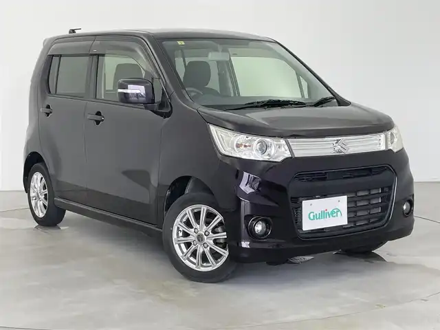 スズキ ワゴンＲ スティングレー X 富山県 2014(平26)年 4.5万km ミステリアスバイオレットパール 4WD/社外ナビ(AM/FM/CD/AUX/iPod)/ワンセグTV/アイドリングストップ/純正フロアマット/革巻きステアリング/スマートキー/プッシュスタート/ベンチシート/パワーステアリング/パワーウィンドウ/ハロゲンヘッドライト/オートライト/フォグランプ/電動格納ミラー/ドアバイザー/バニティミラー