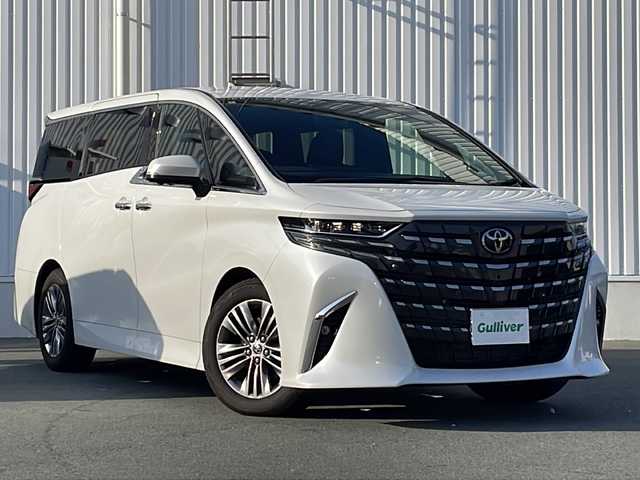 トヨタ アルファード Z 三重県 2024(令6)年 1万km プラチナホワイトパールマイカ 純正14型ナビ/全周囲カメラ/ガラスルーフ/BSM/ワイヤレス充電器/ハーフレザーシート/デジタルインナーミラー/ビルトインETC2.0/両側パワースライドドア/前後コーナーセンサー/パワーバックドア/ステアリングヒーター/革巻きステアリング/ステアリングスイッチ/パワーシート/シートヒーター/エアーシート/タイプC給電ポート/レーダークルーズコントロール/衝突軽減ブレーキ/純正フロアマット/LEDヘッドライト/オートハイビーム/オートライト/スペアキー/電動格納ミラー/禁煙車