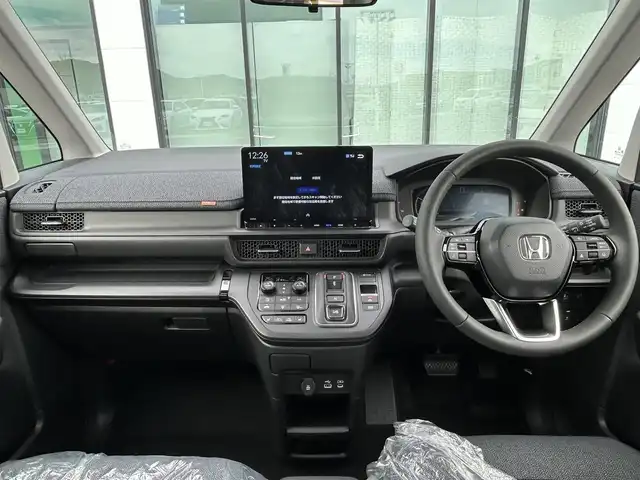 ホンダ ステップワゴン eHEV エアー EX 香川県 2025(令7)年 0.1千km クリスタルブラックパール 登録時走行距離：4km/純正11.4型SDナビゲーション/→フルセグTV/→CD/DVD再生/バックカメラ/ETC2.0/ステアリングリモコン/レーダークルーズコントロール/オットマン/両側パワースライドドア/純正16型アルミホイール/前後コーナーセンサー/LEDオートライト/フォグランプ/オートハイビーム/プッシュスタート/スマートキー/スペアキー