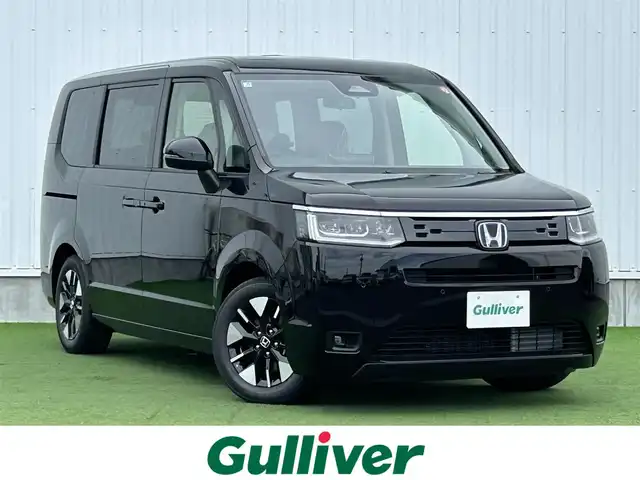 ホンダ ステップワゴン eHEV エアー EX 香川県 2025(令7)年 0.1千km クリスタルブラックパール 登録時走行距離：4km/純正11.4型SDナビゲーション/→フルセグTV/→CD/DVD再生/バックカメラ/ETC2.0/ステアリングリモコン/レーダークルーズコントロール/オットマン/両側パワースライドドア/純正16型アルミホイール/前後コーナーセンサー/LEDオートライト/フォグランプ/オートハイビーム/プッシュスタート/スマートキー/スペアキー