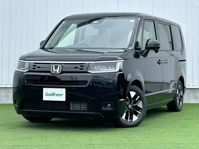 ホンダ ステップワゴン eHEV エアー EX 香川県 2025(令7)年 0.1千km クリスタルブラックパール 登録時走行距離：4km/純正11.4型SDナビゲーション/→フルセグTV/→CD/DVD再生/バックカメラ/ETC2.0/ステアリングリモコン/レーダークルーズコントロール/オットマン/両側パワースライドドア/純正16型アルミホイール/前後コーナーセンサー/LEDオートライト/フォグランプ/オートハイビーム/プッシュスタート/スマートキー/スペアキー