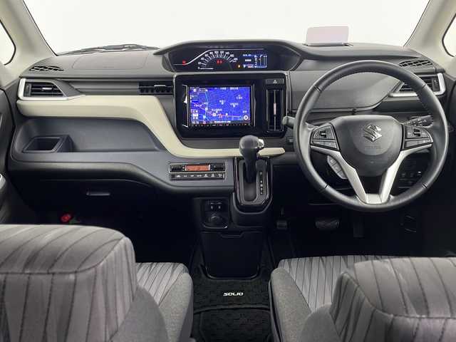 スズキ ソリオ HV MZ 埼玉県 2021(令3)年 1.5万km スターシルバーメタリック 純正8インチナビ/　（AM/FM/iPod/Bluetooth/SD/CD/DVD）/アラウンドビューモニター/フルセグテレビ/ビルトインETC/純正ドライブレコーダー/シートヒーター/ヘッドアップディスプレイ/両側パワースライドドア/衝突被害軽減ブレーキ/クルーズコントロール/レーンアシスト/コーナーセンサー/サーキュレーター/純正フロアマット/純正アルミホイール/LEDヘッドライト/フォグランプ/プッシュスタート