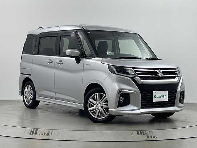 スズキ ソリオ HV MZ 埼玉県 2021(令3)年 1.5万km スターシルバーメタリック 純正8インチナビ/　（AM/FM/iPod/Bluetooth/SD/CD/DVD）/アラウンドビューモニター/フルセグテレビ/ビルトインETC/純正ドライブレコーダー/シートヒーター/ヘッドアップディスプレイ/両側パワースライドドア/衝突被害軽減ブレーキ/クルーズコントロール/レーンアシスト/コーナーセンサー/サーキュレーター/純正フロアマット/純正アルミホイール/LEDヘッドライト/フォグランプ/プッシュスタート