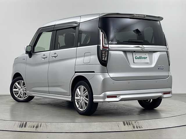 スズキ ソリオ HV MZ 埼玉県 2021(令3)年 1.5万km スターシルバーメタリック 純正8インチナビ/　（AM/FM/iPod/Bluetooth/SD/CD/DVD）/アラウンドビューモニター/フルセグテレビ/ビルトインETC/純正ドライブレコーダー/シートヒーター/ヘッドアップディスプレイ/両側パワースライドドア/衝突被害軽減ブレーキ/クルーズコントロール/レーンアシスト/コーナーセンサー/サーキュレーター/純正フロアマット/純正アルミホイール/LEDヘッドライト/フォグランプ/プッシュスタート