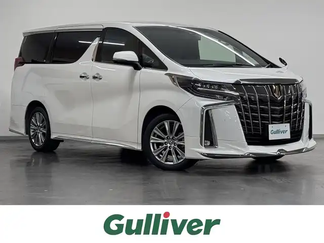 トヨタ アルファード S タイプゴールド 三重県 2020(令2)年 3.6万km ホワイトパールクリスタルシャイン ガソリン/FF/MTモード付インパネCVT/純正 9インチディスプレイオーディオ（ナビ搭載）/（AM/FM/CD・DVD*/USB/iPod/Bluetooth/TV*/Miracast/AppleCarPlay/AndroidAuto）*…OP/12.1インチ 後席モニター V12T-R68C/モデリスタエアロ/・フロントバンパースポイラー、リヤスカート、ヘッドライトガーニッシュ、モデリスタスポーツマフラー/バックガイドモニター/両側パワースライドドア/ドライブレコーダー 前後/ETC/Toyota Safety Sense/●プリクラッシュセーフティ/●レーントレーシングアシスト/●レーダークルコン/●ロードサインアシスト/●アダプティブハイビームシステム/・先行車発進告知機能/・クリアランスソナー/・パーキングサポートブレーキ（前後静止物）/・など/装備/3眼LEDヘッドランプ（専用加飾）/・ハーフレザーシート/・左右＆後席独立オートエアコン/・パワーバックドア/・オットマンシート（2nd）/・AC100Vコンセント（100W）/・ステアリングスイッチ/・電子パーキングブレーキ＆ブレーキホールド/・オートライト/・純正18inAW/・保/取/ナビ取/・スマートキーx1/など