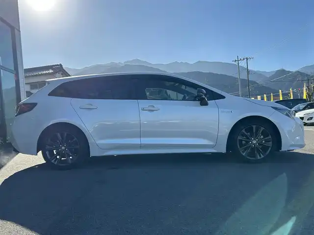 トヨタ カローラツーリング ハイブリッド ダブルバイビー 愛媛県 2020(令2)年 1.5万km ホワイトパールクリスタルシャイン 純正9型ディスプレイオーディオ/バックカメラ/前後ドライブレコーダー/トヨタセーフティセンス/レーダークルーズコントロール/ブラインドスポットモニター/クリアランスソナー/100V/1500Wコンセント/ハーフレザー/シートヒーター/ワイヤレス充電/電格ミラー/ヒートミラー/ステアリングリモコン/ステアリングヒーター/純正ドアバイザー/電動パーキングブレーキ/AutoHold機能/MODELLISTAスカッフプレート/現状サマー(純正AW)(215/45/R17)/YOKOHAMA ADVANdB V552/禁煙車