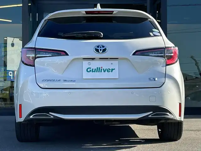 トヨタ カローラツーリング ハイブリッド ダブルバイビー 愛媛県 2020(令2)年 1.5万km ホワイトパールクリスタルシャイン 純正9型ディスプレイオーディオ/バックカメラ/前後ドライブレコーダー/トヨタセーフティセンス/レーダークルーズコントロール/ブラインドスポットモニター/クリアランスソナー/100V/1500Wコンセント/ハーフレザー/シートヒーター/ワイヤレス充電/電格ミラー/ヒートミラー/ステアリングリモコン/ステアリングヒーター/純正ドアバイザー/電動パーキングブレーキ/AutoHold機能/MODELLISTAスカッフプレート/現状サマー(純正AW)(215/45/R17)/YOKOHAMA ADVANdB V552/禁煙車