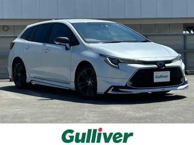 トヨタ カローラツーリング ハイブリッド ダブルバイビー 静岡県 2022(令4)年 0.8万km プラチナホワイトパールマイカ モデリスタフルエアロ/純正９型ディスプレイ/ナビ/フルセグＴＶ/バックカメラ/ＥＴＣ２．０/純正ドラレコ/ＲＣＴＡ/ＢＳＭ/シートヒーター/ハーフレザー/ＬＥＤヘッドライト/フォグライト/純正１７ＡＷ