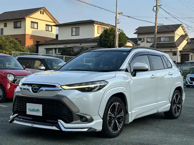 トヨタ カローラ クロス ハイブリッド Z 熊本県 2021(令3)年 3.7万km プラチナホワイトパールマイカ モデリスタエアロ/モデリスタ18インチAW/スカイルーフ/ワンオーナー/衝突軽減ブレーキ/レーンキープアシスト/プッシュスタート/純正ナビ/（フルセグTV・BTオーディオ）/全方位カメラ/ビルトインETC/前後ドライブレコーダー/レーダークルーズ/パワーバックドア/ルーフレール/右前席パワーシート/前席シートヒーター/LEDヘッドライト/オートライト/フォグライト/前後コーナーセンサー/横滑り防止装置/ウィンカーミラー/純正フロアマット/純正ドアバイザー/新車保証書/取扱説明書/スマートスペアキー×1本