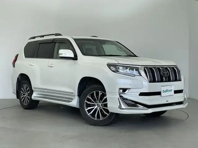 トヨタ ランドクルーザー プラド TZ－G 富山県 2020(令2)年 8.4万km ホワイトパールクリスタルシャイン 4WD/7人乗り/モデリスタエアロ/サンルーフ/純正ナビ（FM/AM/BT）/AppleCarPlay/AndroidAuto/フルセグTV/全方位カメラ/レーダークルーズコントロール/本革シート/前席パワーシート/D席シートメモリー/前席エアシート/ビルトインETC2.0/前後ドライブレコーダー/スマートキー/スペアキー1本/プッシュスタート/レーンキープアシスト/衝突被害軽減システム/BSM/前後コーナーセンサー/センターデフロック/ダウンヒルアシストコントロール/純正フロアマット/ラゲッジマット/パドルシフト/純正19インチAW
