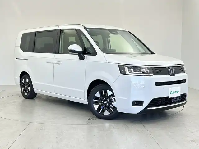 ホンダ ステップワゴン eHEV エアー EX 愛知県 2025(令7)年 0.1千km パール 登録済未使用車/純正ナビ/・フルセグ/・Bluetooth/・Apple Car Play/・Android Auto/・CD/・DVD/両側パワースライドドア/前席シートヒーター/バックカメラ/追従型クルコン/レーンキープアシスト/衝突軽減ブレーキ/コーナーセンサー/盗難防止装置/横滑り防止装置/純正アルミホイール/LEDヘッドライト/スマートキー/スペアキー/保証書/取扱説明書