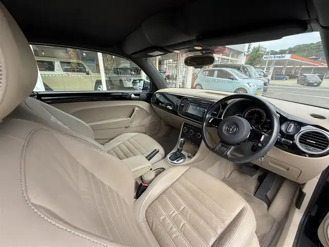 フォルクスワーゲン ザ・ビートル カブリオレ 長崎県 2014(平26)年 10.5万km 黒 登録時104120km/純正ナビ/・TV/・DVD/・Bluetooth/バックカメラ/D＋N席シートヒーター/オートヘッドライト/オープンカー/電動格納ミラー/MT付きAT