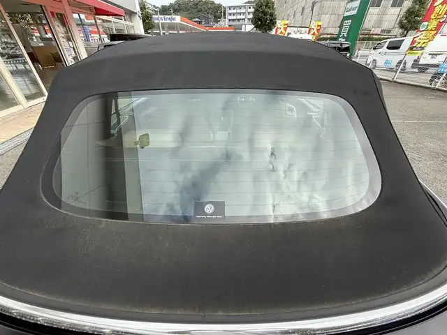 フォルクスワーゲン ザ・ビートル カブリオレ 長崎県 2014(平26)年 10.5万km 黒 登録時104120km/純正ナビ/・TV/・DVD/・Bluetooth/バックカメラ/D＋N席シートヒーター/オートヘッドライト/オープンカー/電動格納ミラー/MT付きAT
