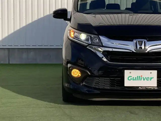 ホンダ フリード ハイブリット G ホンダセンシング 香川県 2016(平28)年 7.9万km クリスタルブラックパール パナソニック7型ナビ(CN-RX03D)/→AM/FM/フルセグTV/Bluetooth/CD/DVD/ホンダセンシング/・衝突軽減ブレーキ/・誤発進抑制機能/・歩行者事故低減ステアリング/・路外逸脱抑制機能/・渋滞追従機能付アダプティブ・クルーズ・コントロール/・車線維持支援システム/・オートハイビーム/バックカメラ/両側パワースライドドア/LEDヘッドライト/社外LEDフォグランプ/オートライト/前後ドライブレコーダー/ETC/社外16インチAW（SPORT KRONE）/電動格納ウィンカーミラー/アイドリングストップ/横滑り防止装置/パワーウィンドウ/オートエアコン/プッシュスタート/スマートキー