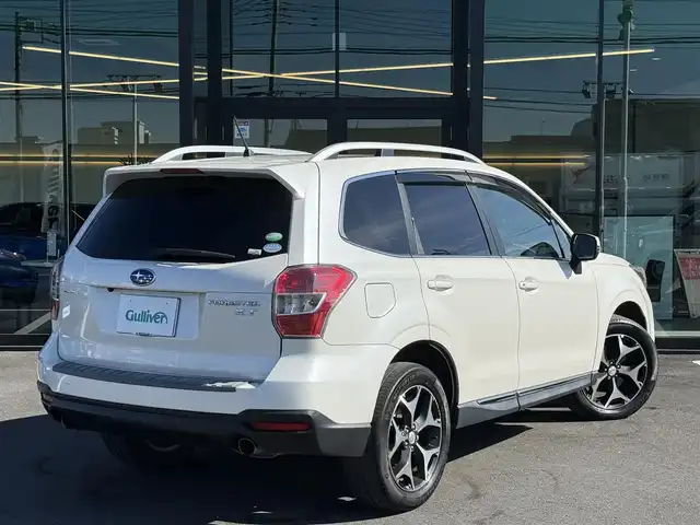 スバル フォレスター 2．0XT アイサイト 栃木県 2014(平26)年 11万km サテンホワイトパール 車検期限令和9年6月23日まで/サンルーフ/社外ナビ/Bluetoothオーディオ/DVD再生機能/フルセグTV走行中視聴可能/バックカメラ/アイサイト/レーダークルーズコントロール/パワーバックドア/ハーフレザーシート/パワーシート/シートヒーター/純正18インチAW/スマートキー×2