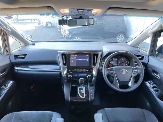 トヨタ アルファード S 神奈川県 2023(令5)年 1.3万km ホワイトパールクリスタルシャイン ワンオーナー/ダブルサンルーフ/純正ナビ（BT/AM/FM/Miracast）/フルセグTV/バックカメラ/トヨタセーフティセンス/レーンキープアシスト/レーダークルーズコントロール/クリアランスソナー/オートハイビーム/横滑り防止装置/両側パワースライドドア/革巻きステアリング/ステアリングスイッチ/LEDヘッドライト/フォグランプ/ビルトインETC/社外フロアマット/純正ドアバイザー/スマートキー　2本/プッシュスタート/保証書/取扱説明書