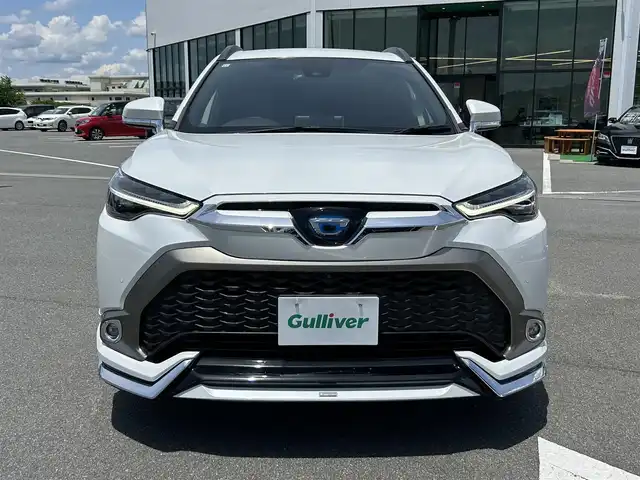 トヨタ カローラ クロス ハイブリッド Z 奈良県 2021(令3)年 3.2万km プラチナホワイトパールマイカ 純正ディスプレイオーディオ　/フルセグテレビ　/テレビキャンセラー/パワーバックドア　/ビルトインＥＴＣ２．０　/オートハイビーム　/全方位モニター　/プリクラッシュセーフティー　/ブラインドスポットモニター　/コーナーセンサー/アダブティブクルーズコントロール/オートハイビーム/パワシート（運転席のみ）/シートヒーター/純正アルミホイール/フルエアロ（フロント・サイド・リア）/LEDフロントライト/取り扱い説明書/保証書/スペアキーあり