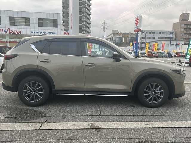 マツダ ＣＸ－５ XD フィールドジャーニー 富山県 2022(令4)年 1万km ジルコンサンドメタリック ４WD/全周囲カメラ/スマートキー/ハーフレザーシート/衝突安全ブレーキ/メーカーOPメモリーナビ/BT接続・フルセグTV/ヘッドアップディスプレイ/ETC２．０/パドルシフト/メモリー付きパワーシート/レーダークルーズコントロール/車線逸脱警報/電格ウィンカーミラー/前後ドラレコ(HF-AHD-2309Y)/パドルシフト/シートヒーター/ステアリングヒーター/保証書・取説・ナビ取説/スペアキー（スマートキー）