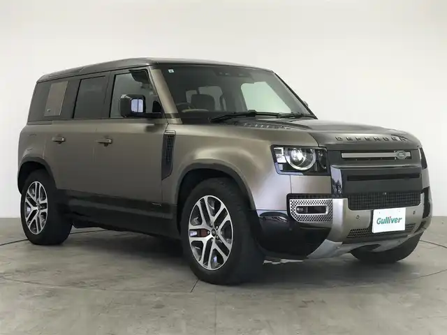 ランドローバー ランドローバー ディフェンダー XトロフィーED 愛知県 2021(令3)年 4.8万km 茶 20台限定特別仕様車/ボディーカラー「ゴンドワナストーン」/インテリアカラー「ヴィンテージタン／エボニー」/プロテクションフィルム施工済み/ワンオーナー/スライディングパノラミックルーフ/メリディアンサラウンドサウンド/コールドクライメートパック/赤キャリパー/ヘッドアップディスプレイ/置くだけ充電/デジタルインナーミラー/純正ナビ（Bluetooth/Apple CarPlay）/全方位カメラ/BSM/ACC/衝突軽減システム/レーンアシスト/コーナーセンサー/ETC2.0/パワーシート/シートヒーター/シートクーラー/メモリシート/ステアリングヒーター/ドライブレコーダー/純正AW/純正LEDライト/オートライト/ダウンヒルアシストコントロール/背面タイヤ