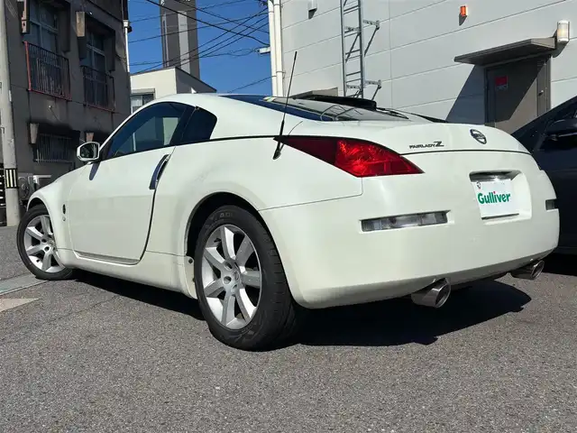 日産 フェアレディ Ｚ バージョンT 愛知県 2004(平16)年 1.8万km ホワイトパール ＢＯＳＥサウンド　７スピーカー　６ＣＤチェンジャー　ＥＴＣ　本革シート　シートヒーター　パワーシート　ＨＩＤライト　オートエアコン　純正１７インチアルミホイール　キーレスエントリー　スペアキー