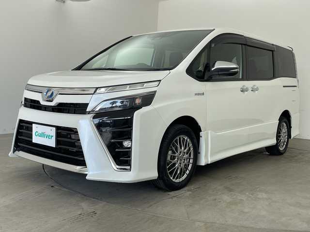 トヨタ ヴォクシー ハイブリッド ZS 煌Ⅱ 兵庫県 2019(平31)年 5.1万km ホワイトパールクリスタルシャイン ・トヨタセーフティーセンス/・プリクラッシュセーフティ/・レーンディバチャーアラート/・オートハイビーム/・パーキングサポートブレーキ/・クリアランスソナー/・先行車発進告知/・社外９インチメモリナビ/・フルセグ＆BT&DVD＆SD/・バックカメラ/・社外前方ドライブレコーダー/・両側パワースライドドア/・LEDヘッドライト/・フォグ/・オートライト/・ETC/・スマートキー/・プッシュスタート/・クルーズコントロール/・前席シートヒーター/・リヤエアコン/・革巻きステアリング