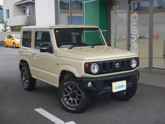スズキ ジムニー XC 静岡県 2021(令3)年 4.2万km シフォンアイボリーM ワンオーナー/新車保証書/デュアルセンサーブレーキサポート/車線逸脱警報/パートタイム4WD/・高低二段切り替え式（後輪駆動ベース）/スマートキー×2/プッシュスタート/インタークーラーターボエンジン/ヘッドライトウォッシャー/オートライト/社外フロアマット/バックカメラ（本体のみ）/背面タイヤ/TOYO TIRES オープンカントリーR/T/前席シートヒーター/ウインカー付きドアミラー/新車保証書/取り扱い説明書