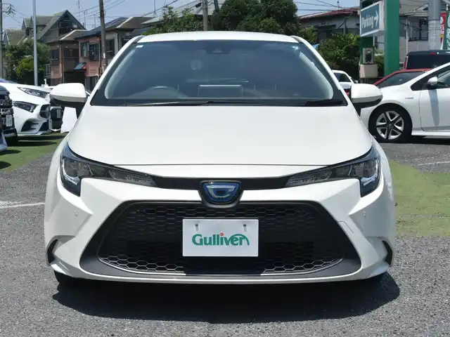 トヨタ カローラツーリング ハイブリッド S 神奈川県 2021(令3)年 1.8万km ホワイトパールクリスタルシャイン ワンオーナー/純正メモリナビ/フルセグテレビ/バックカメラ/アダプティブクルーズ/プッシュスタート/スマートキー/ETC2.0/LEDヘッドライト/スペアスマートキー/保証書/取説/ナビ説/記録(R.4.5.6)