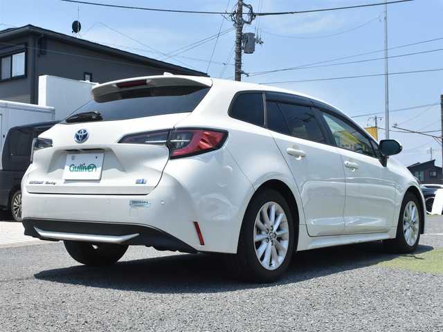 トヨタ カローラツーリング ハイブリッド S 神奈川県 2021(令3)年 1.8万km ホワイトパールクリスタルシャイン ワンオーナー/純正メモリナビ/フルセグテレビ/バックカメラ/アダプティブクルーズ/プッシュスタート/スマートキー/ETC2.0/LEDヘッドライト/スペアスマートキー/保証書/取説/ナビ説/記録(R.4.5.6)